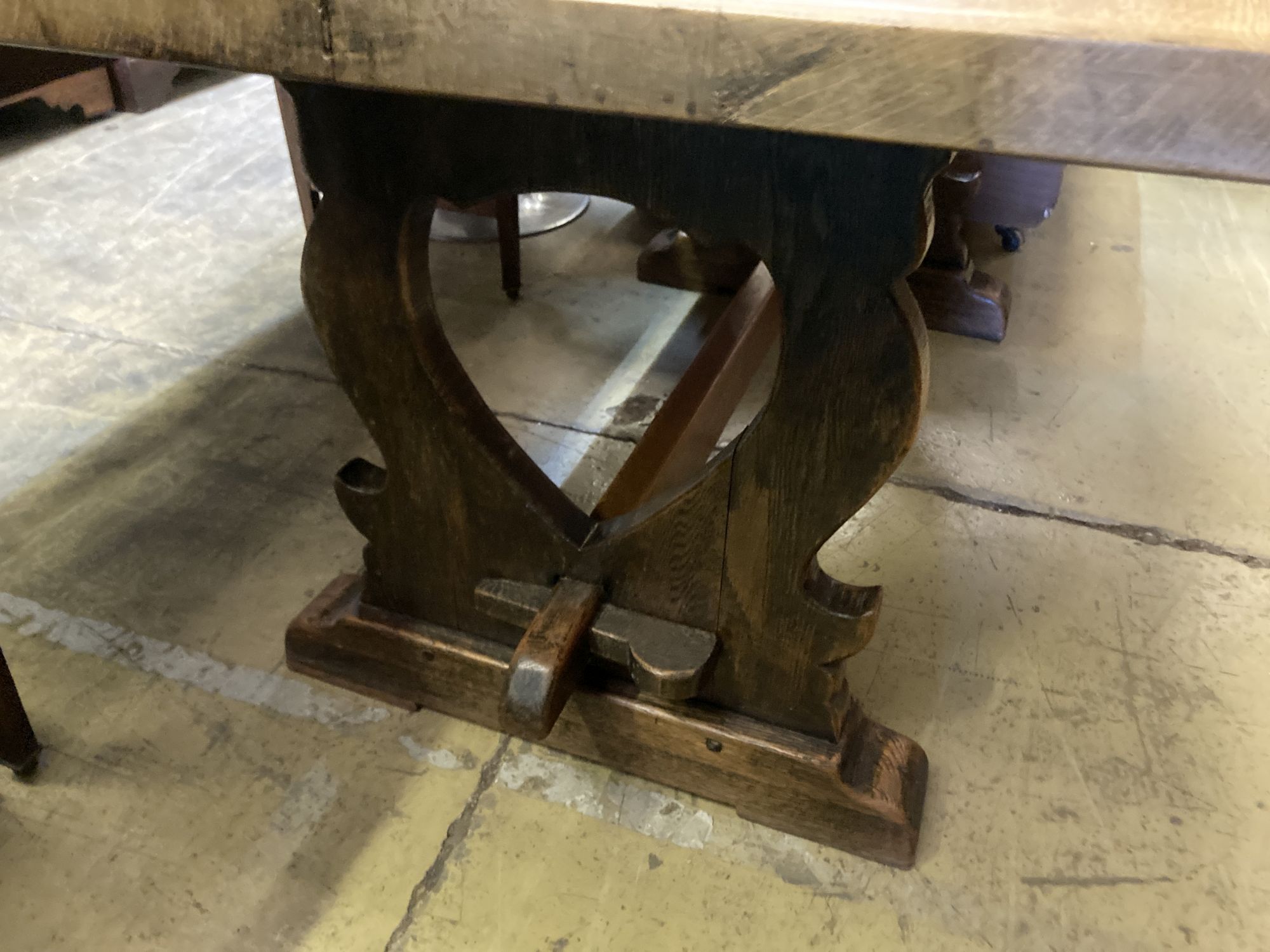 An 18th century style rectangular oak refectory dining table with vase shaped trestle ends, length 168cm, depth 90cm, height 76cm